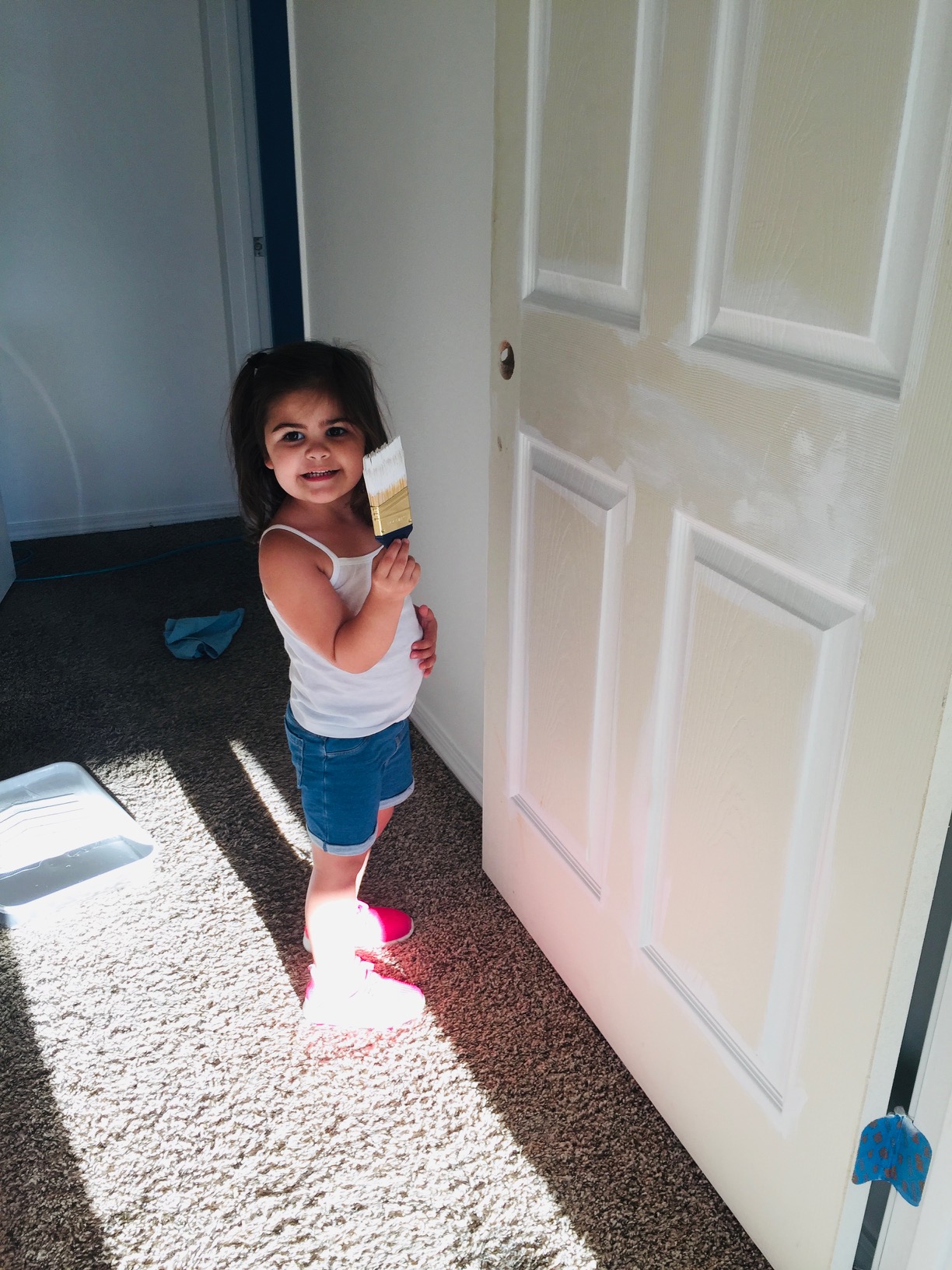 Young Dylan painting a door, real work even at a young age